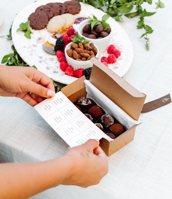 Jessica foster truffles box open | Santa Barbara Chocolate